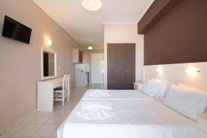 Postel nebo postele na pokoji v ubytování Dados Hotel