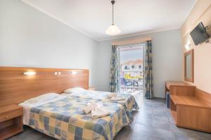 Postel nebo postele na pokoji v ubytování Dados Hotel