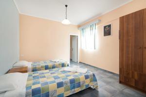Postel nebo postele na pokoji v ubytování Dados Hotel