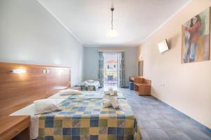 Postel nebo postele na pokoji v ubytování Dados Hotel