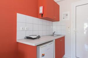 Kuchyň nebo kuchyňský kout v ubytování Dados Hotel