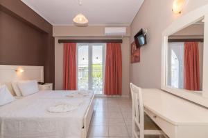 Postel nebo postele na pokoji v ubytování Dados Hotel