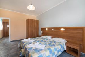 Postel nebo postele na pokoji v ubytování Dados Hotel
