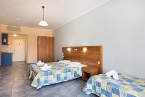 Postel nebo postele na pokoji v ubytování Dados Hotel