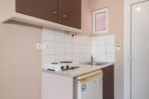 Kuchyň nebo kuchyňský kout v ubytování Dados Hotel
