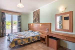 Postel nebo postele na pokoji v ubytování Dados Hotel