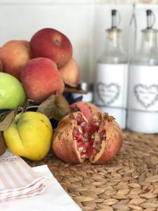 a table with apples and other fruits on it at Holiday House Vego in Čapljina
