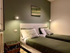 Postel nebo postele na pokoji v ubytování Porta Ronca - B&B, Suites & Apts
