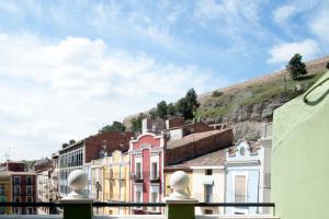 a group of buildings with a hill in the background at Ático del Holandés in Balaguer