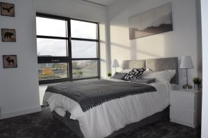 Un ou plusieurs lits dans un hébergement de l'établissement London City Island 3 Bedroom Luxury Apartments, Canary Wharf