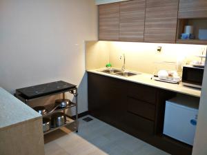 Kuchyň nebo kuchyňský kout v ubytování Classy Studio Apartment (KBCP)
