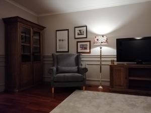 Televízia a/alebo spoločenská miestnosť v ubytovaní apartament