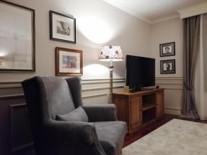 Televízia a/alebo spoločenská miestnosť v ubytovaní apartament