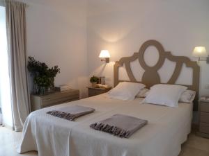 Łóżko lub łóżka w pokoju w obiekcie Exclusiva Villa con Piscina Privada, Villa Juandana