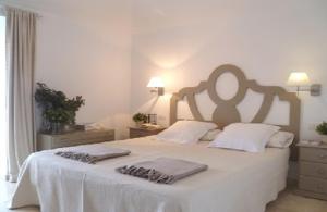 Łóżko lub łóżka w pokoju w obiekcie Exclusiva Villa con Piscina Privada, Villa Juandana