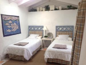 Łóżko lub łóżka w pokoju w obiekcie Exclusiva Villa con Piscina Privada, Villa Juandana