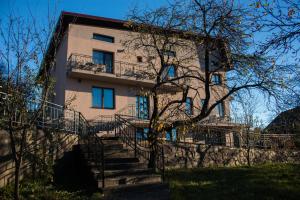 a building with stairs in front of a building at Panoramic in Baia-Sprie