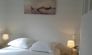 Postel nebo postele na pokoji v ubytování Blanc d'ecume