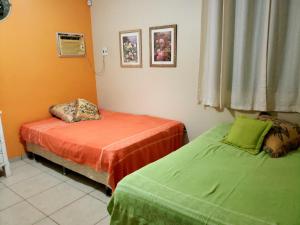 En eller flere senge i et værelse på Casa Sitio Região dos Lagos 1200m2 terreno- S Pedro DAldeia + 47 billeder