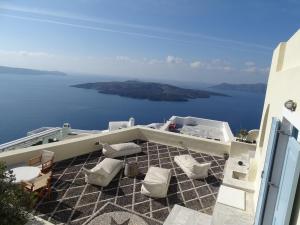 a balcony with toilets and a view of the ocean at 360 Blue in Fira