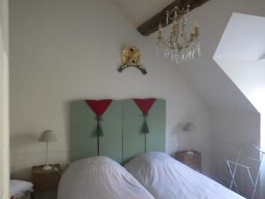 Postel nebo postele na pokoji v ubytování castel de la comtesse