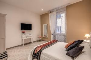 Voodi või voodid majutusasutuse Vatican Royal Apartment toas