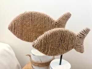 a knitted hat on top of a table at Fat Frog Beach Houses in Byron Bay