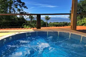 a pool of water with a blue sky at Casa Vistas del Conde in Heredia