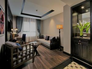 Postel nebo postele na pokoji v ubytování Lotus Aroma Sapa Hotel