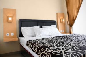 Posteľ alebo postele v izbe v ubytovaní Villa Rumah Bromo