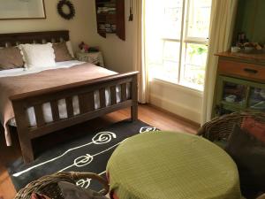 a bedroom with a bed and a window at Belgrave Hideaway in Belgrave