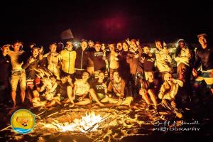 a group of people standing around a fire at Phan rang kite center in Ấp Mỹ Hải