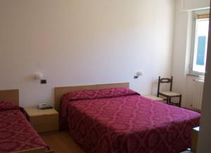 Posteľ alebo postele v izbe v ubytovaní Hotel Ristorante Anita