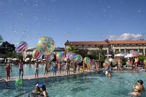 a group of people in the water at a swimming pool at Hotel Caesius Thermae & Spa Resort in Bardolino
