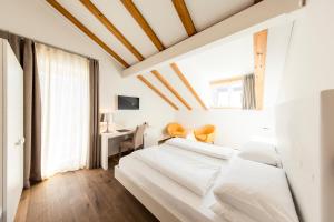 Postel nebo postele na pokoji v ubytování Boutique Hotel Zum Rosenbaum