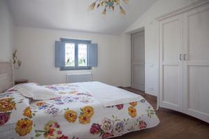 Postel nebo postele na pokoji v ubytování Podere La Contessa B&B