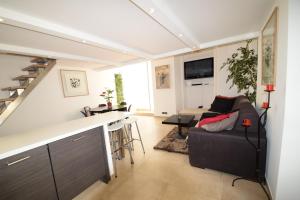 a living room with a couch and a table at Jade Duplex - No Better Location In Nice in Nice