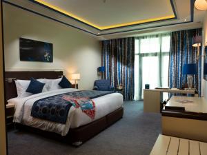 Katil atau katil-katil dalam bilik di Retaj Salwa Resort & Spa