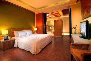 เตียงในห้องที่ Jing Hwa Motel