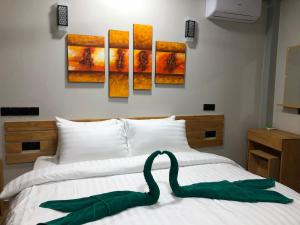 Voodi või voodid majutusasutuse IRIS Beach Residence toas