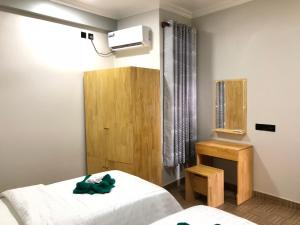 Voodi või voodid majutusasutuse IRIS Beach Residence toas
