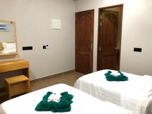 Voodi või voodid majutusasutuse IRIS Beach Residence toas