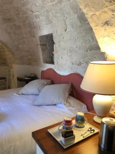Postel nebo postele na pokoji v ubytování Relais Masseria Serritella