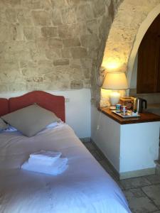 Postel nebo postele na pokoji v ubytování Relais Masseria Serritella
