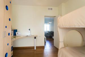 a bedroom with a bunk bed and a desk at TEATRO centro alicante in Alicante