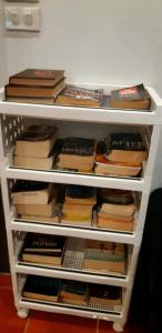 a book shelf filled with lots of books at Lanta Hostel in Ko Lanta