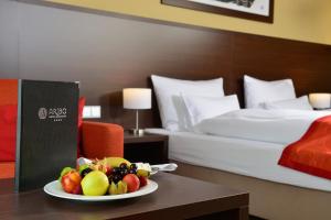 Postel nebo postele na pokoji v ubytování Aribo Hotel