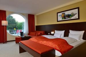 Postel nebo postele na pokoji v ubytování Aribo Hotel