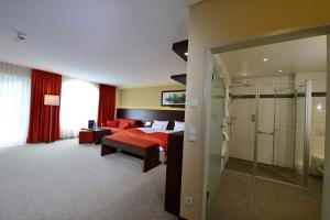 Postel nebo postele na pokoji v ubytování Aribo Hotel