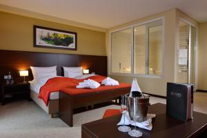 Postel nebo postele na pokoji v ubytování Aribo Hotel